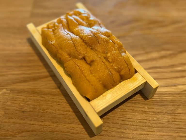 “Wild Santa Barbara uni in a traditional wooden tray, private raw bar service.”